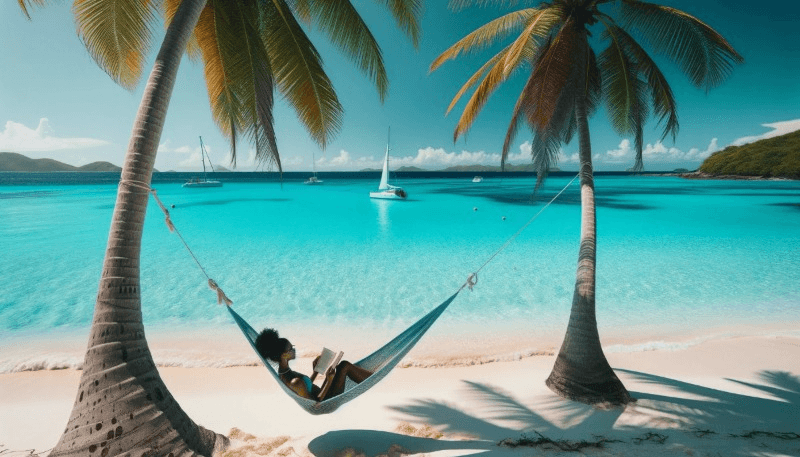 Photo of a pristine white-sand beach in the Caribbean. Crystal-clear turquoise waters lap the shore, and a woman of African descent relaxes on a hammock between two palm trees, reading a book